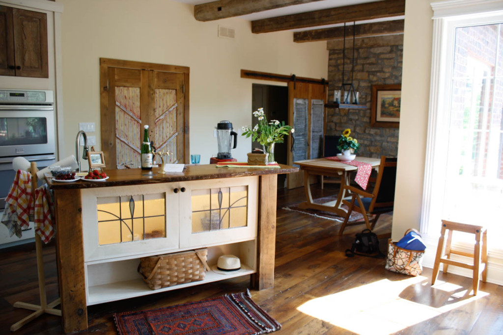 custom island with rough-cut wood and wood countertops